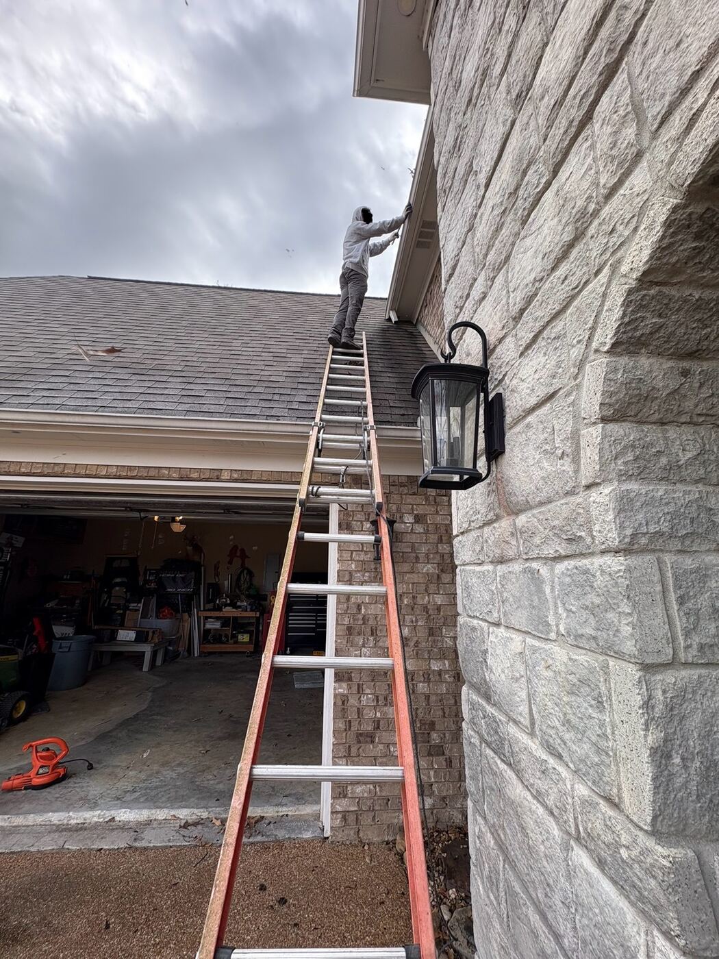 Apex exterior cleaning crew on a gutter cleaning job in DeSoto County, MS